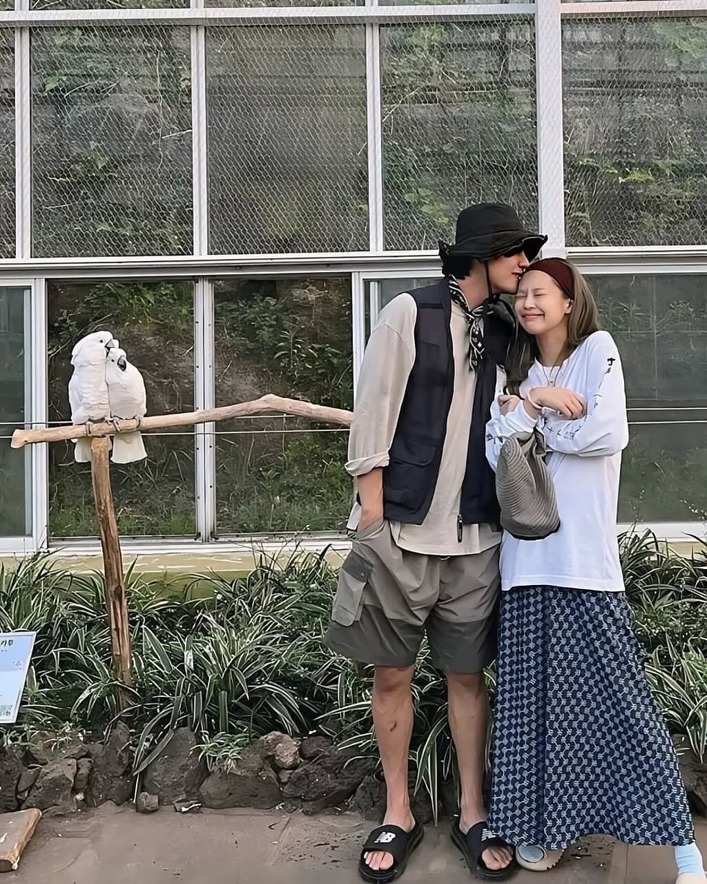 Photo by V on October 23, 2025. May be an image of people kissing, parrot, lorikeet, macaw and text.