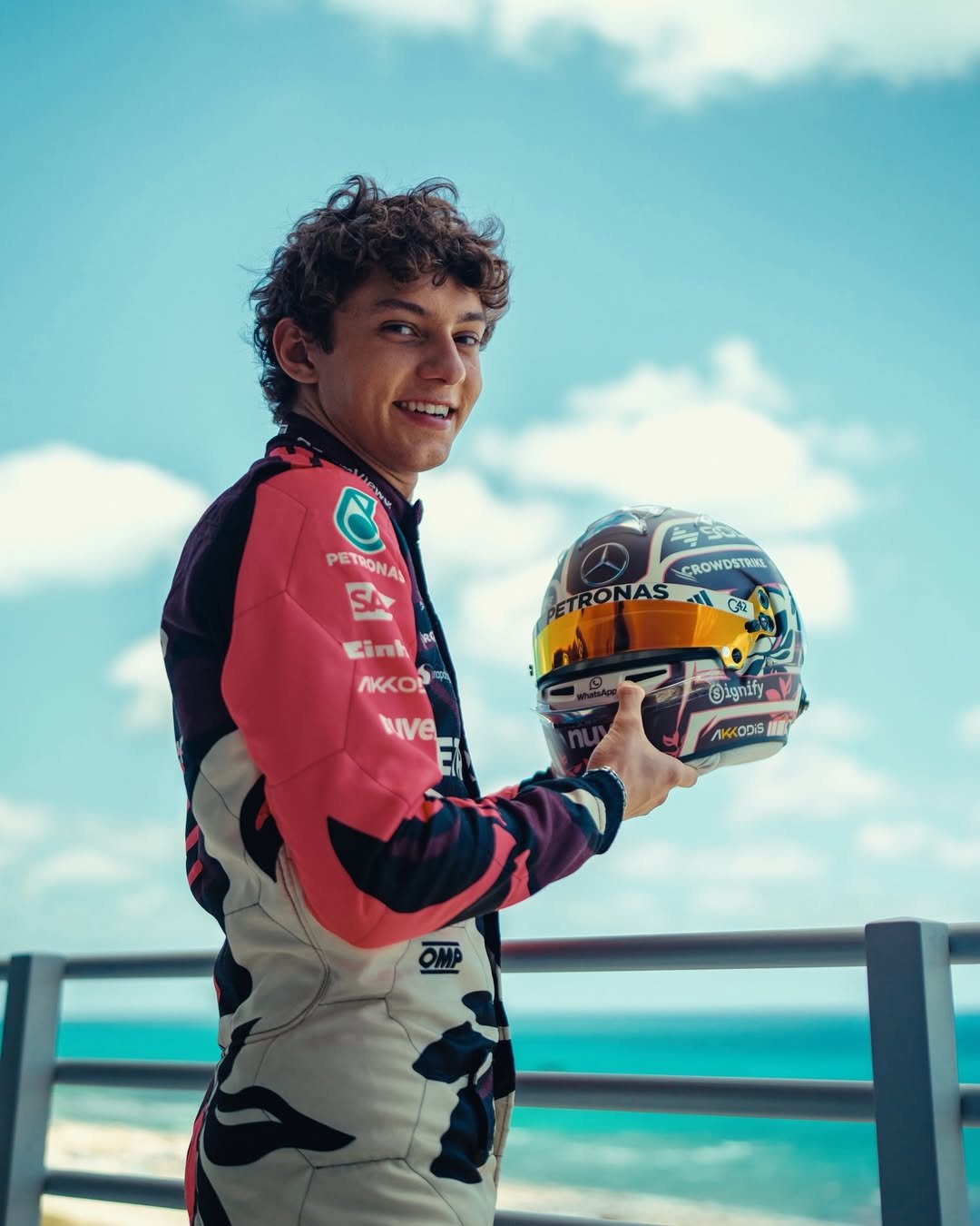 Photo by Andrea Kimi Antonelli on December 22, 2025. May be an image of racing vehicles, race car, helmet and text that says 'B PETIONAL CROWOSTREL GETRONAS RONAS Cinh Ci មា AKKOP Nve Oignily ignify'.