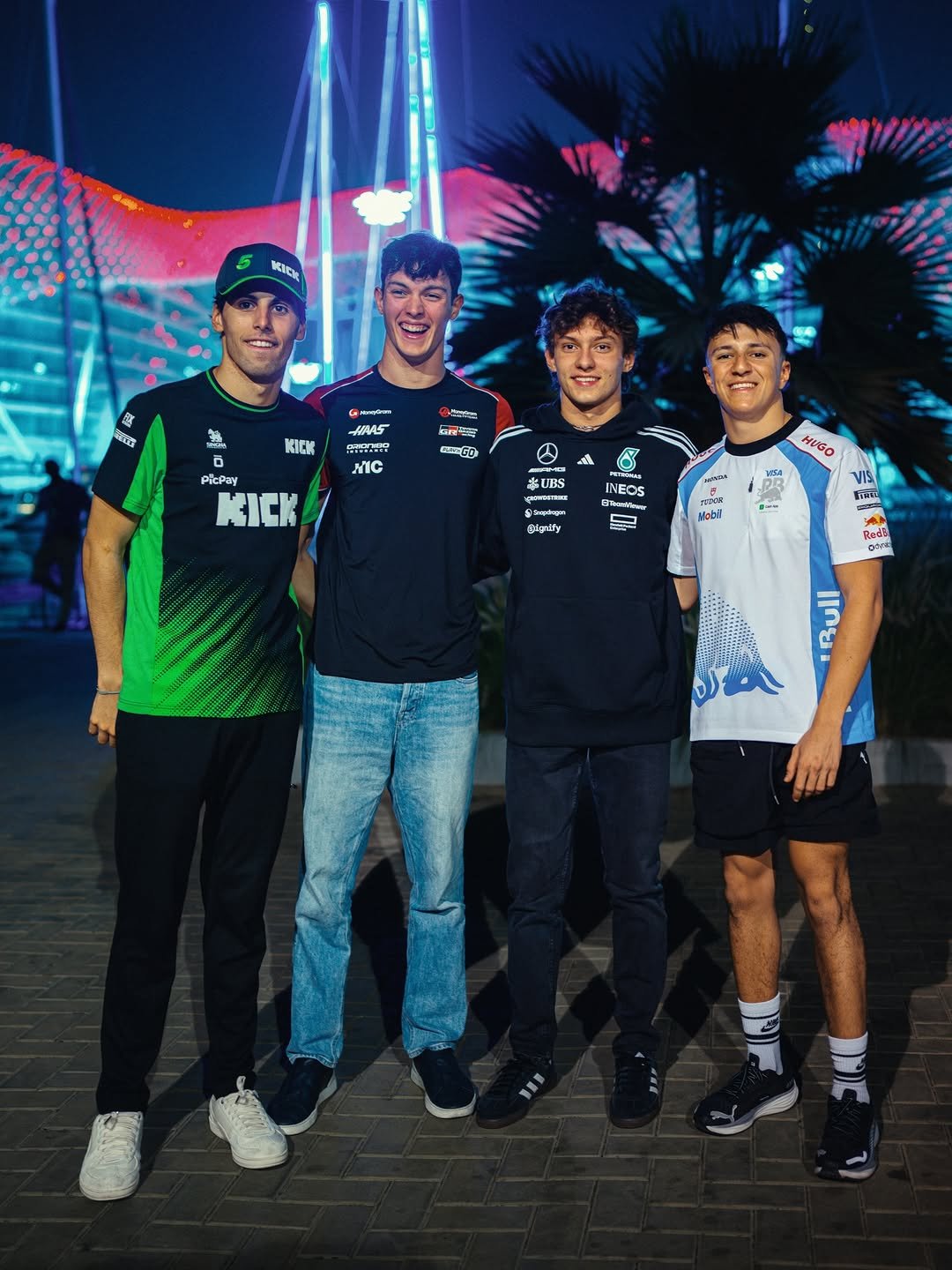 Photo by Andrea Kimi Antonelli in Yas Marina Circuit with @gabrielbortoleto_, @olliebearman, and @isackhadjar. May be a video game screenshot of one or more people, top, stadium and text.