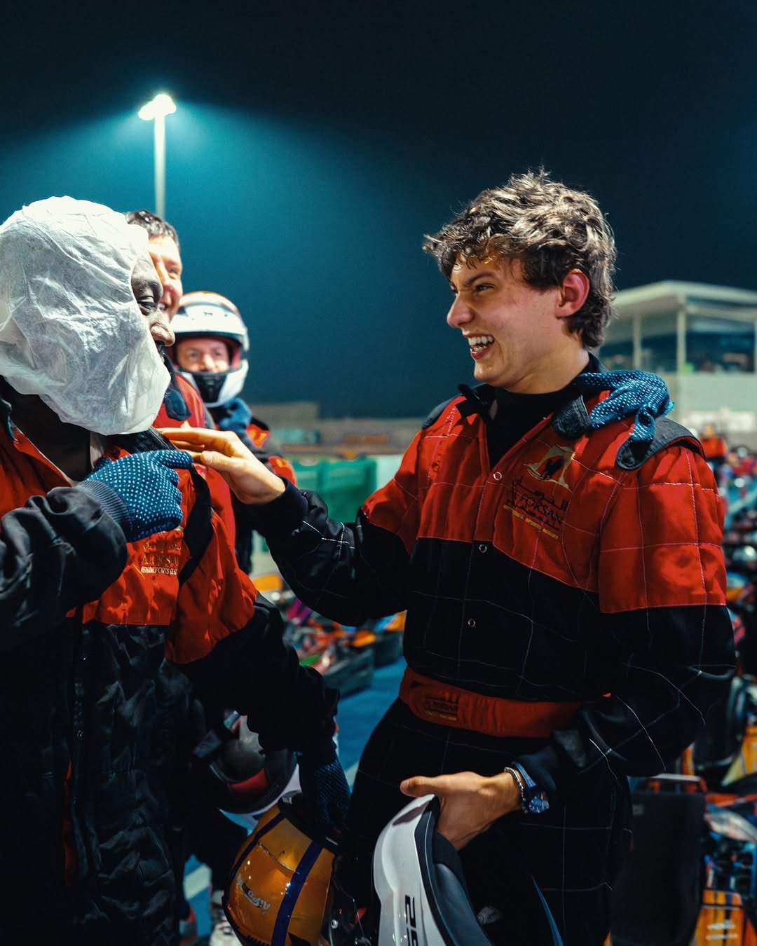 Photo by Andrea Kimi Antonelli on December 02, 2025. May be an image of racing vehicles, snowsuit, ski, helmet, ski slope, stadium and text.