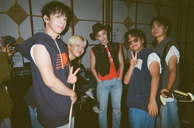 Photo by SUHO on October 05, 2025. May be an image of 4 people, bangs, top, bolo tie and text.