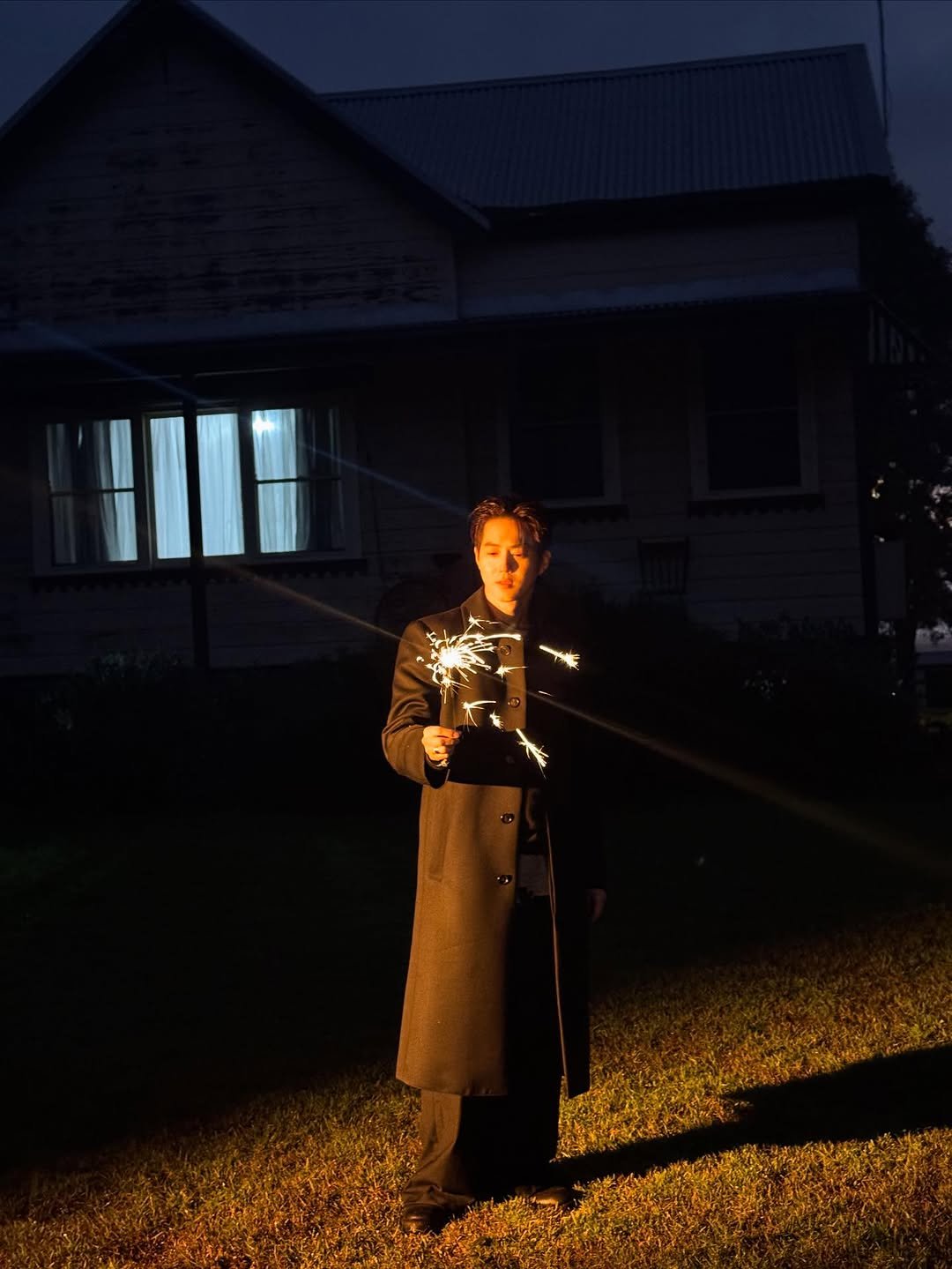 Photo by SUHO on October 22, 2025. May be an image of fire, lighting, sparkler, lantern, fireworks and text.