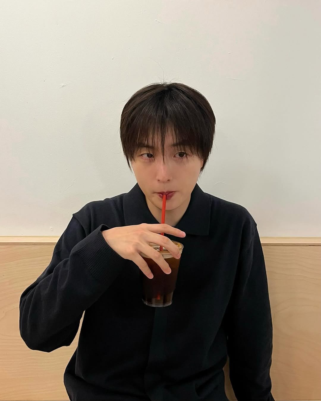 Photo shared by 정 한 on September 25, 2025 tagging @anotheroffice_official. May be an image of 1 person, drink and text.