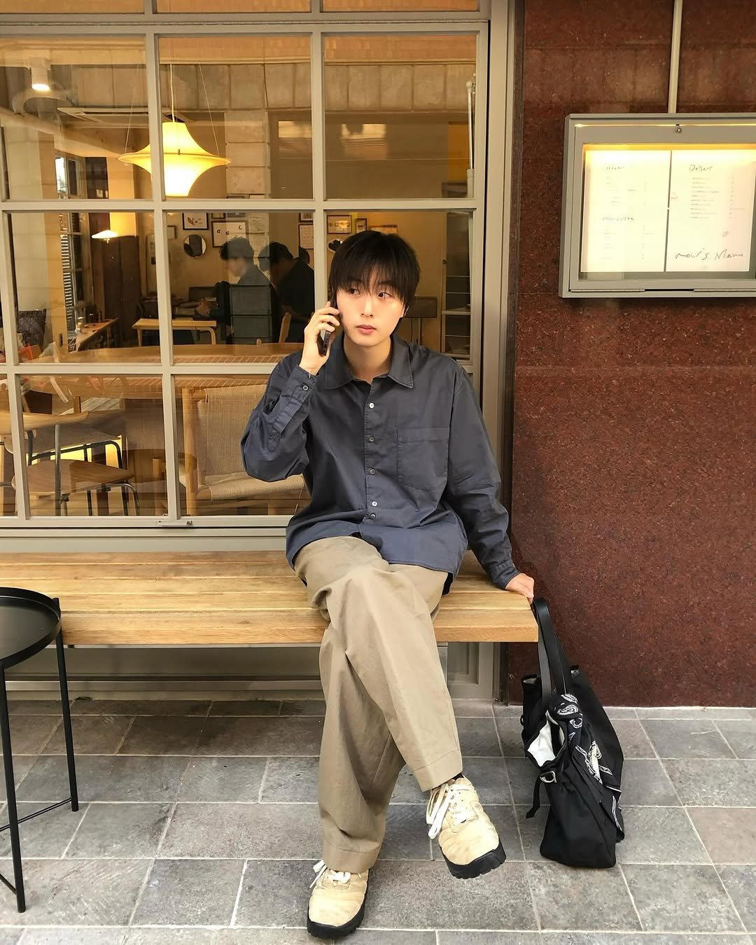 Photo shared by 정 한 on September 19, 2025 tagging @anotheroffice_official. May be an image of 2 people, duffle coat, overcoat, wingtip shoes, parka, cornflower and text.