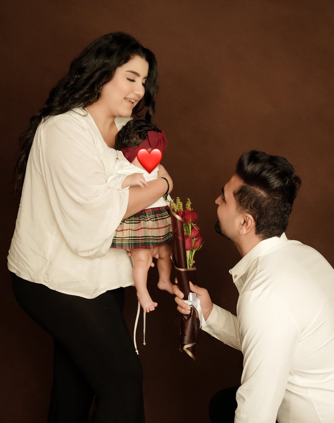 Photo shared by Kirti Singh raheja on February 14, 2026 tagging @rohit_skrraheja. May be an image of baby, people kissing and text.