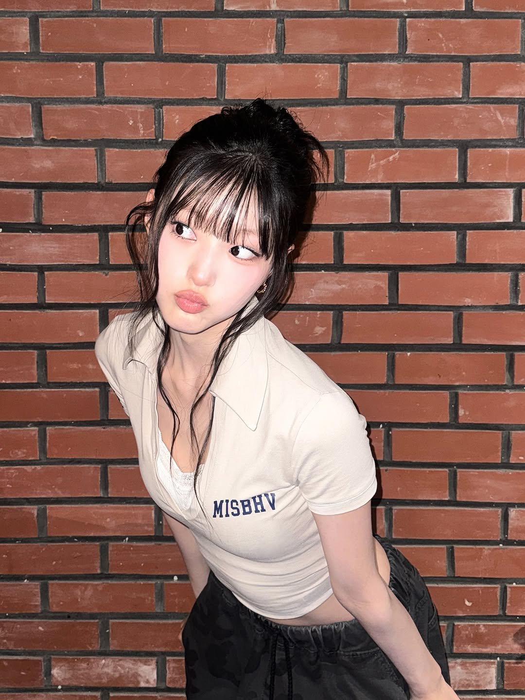 Photo by KISS OF LIFE on September 25, 2025. May be an image of 1 person, hair, brick wall and text that says 'MISBHV'.