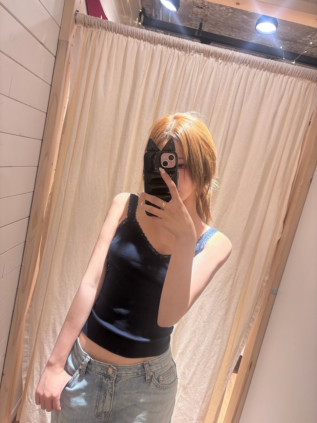 Photo by KISS OF LIFE on September 24, 2025. May be an image of 1 person, mirror, clothes hanger and text.