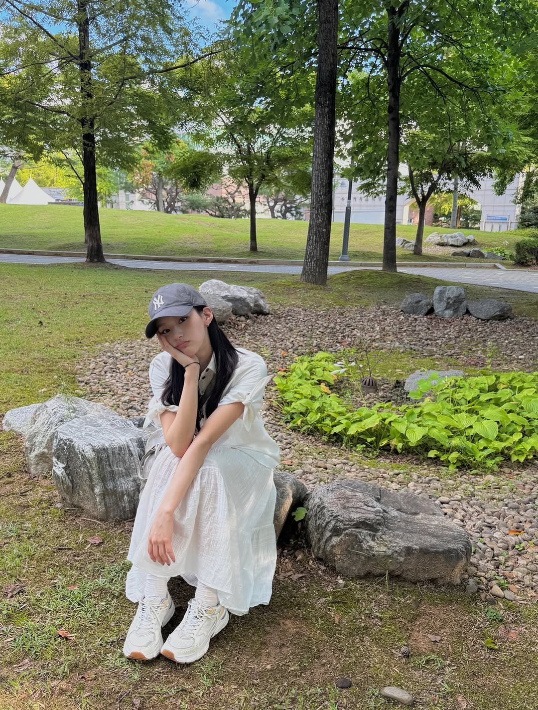 Photo by KISS OF LIFE on August 15, 2025. May be an image of 1 person, grass and text.
