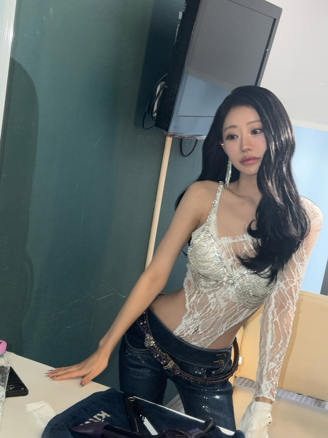 Photo by KISS OF LIFE on April 23, 2026. May be an image of one or more people, hair, top, bra and text.