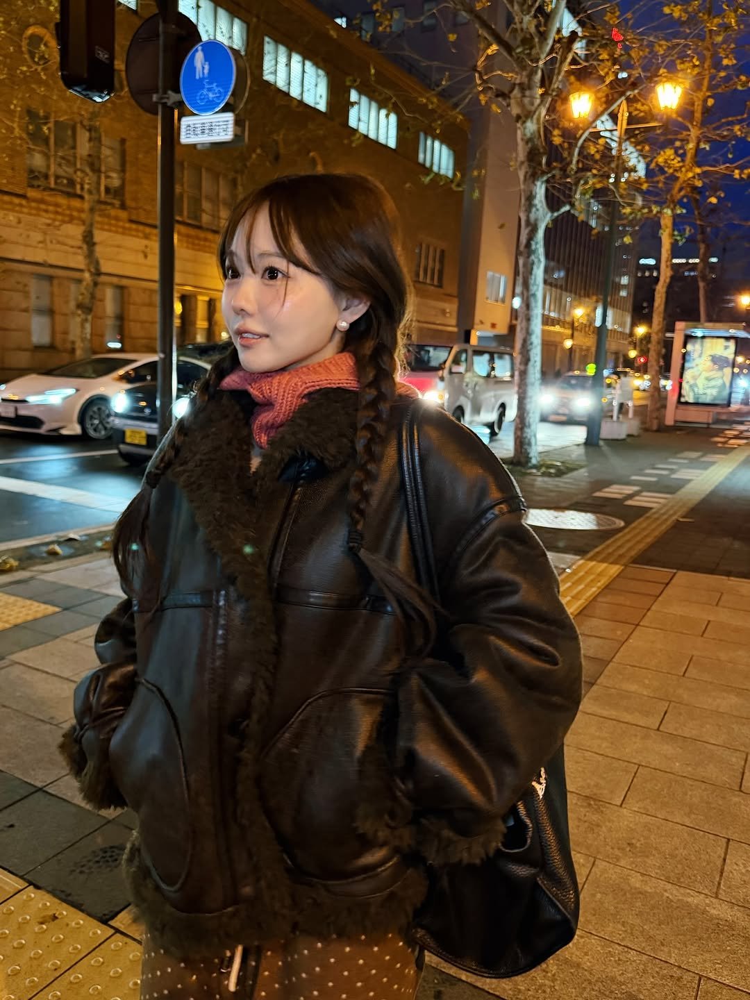 Photo by 홍영기 on December 15, 2025. May be an image of one or more people, duffle coat, parka, street, night and text.