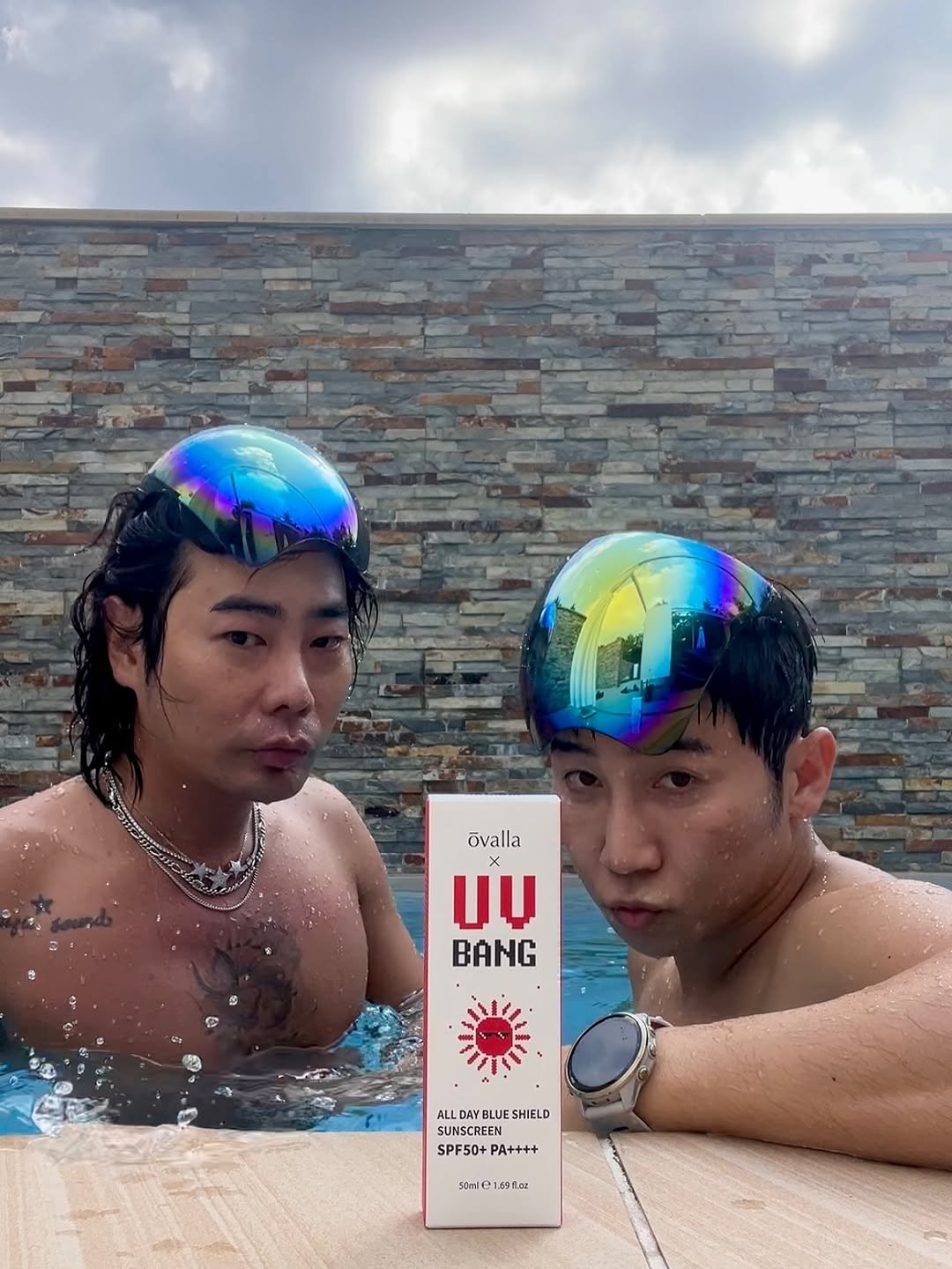 Photo shared by @uv_bang_official on August 04, 2025 tagging @kkachi99, @ovalla_cosmetic, and @__muzie__. May be an image of 2 people, people swimming, beach ball, pool and text that says 'övalla UU BANG 7 AYEHELD ALL DAY BLUE SHIELD SUNSCREEN SPF50+ SPFS0+PA++++ PA++++ 50mlC 91 flar'.