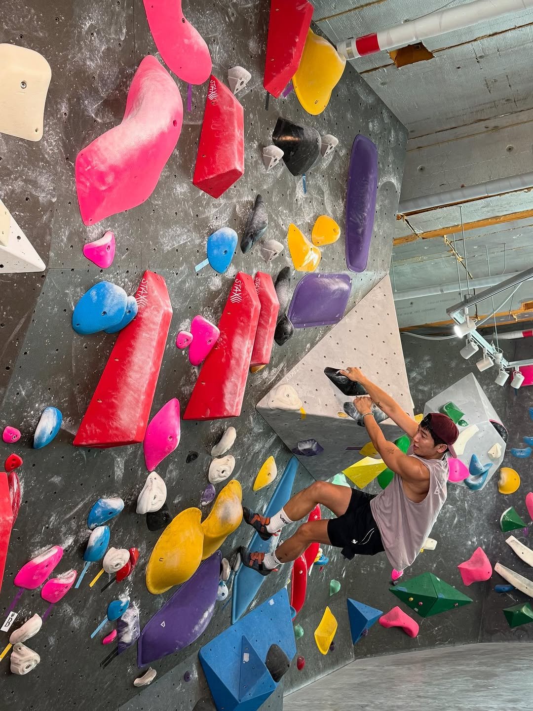 Photo by 유세윤 on August 10, 2025. May be an image of 1 person, climbing, pegboard and text.