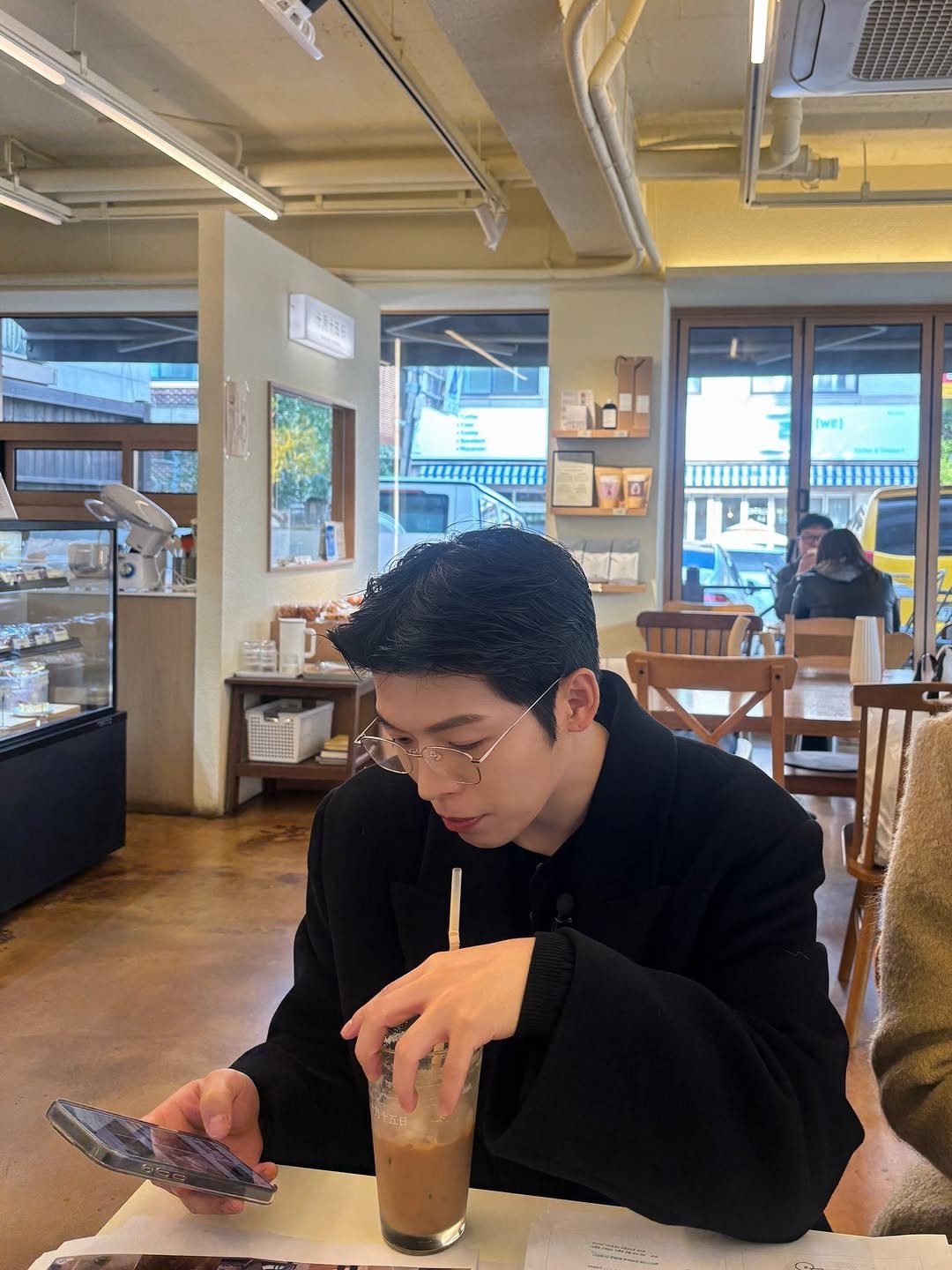 Photo by Daeheon Kang on November 01, 2025. May be an image of studying, drink, duffle coat, cornflower and text.