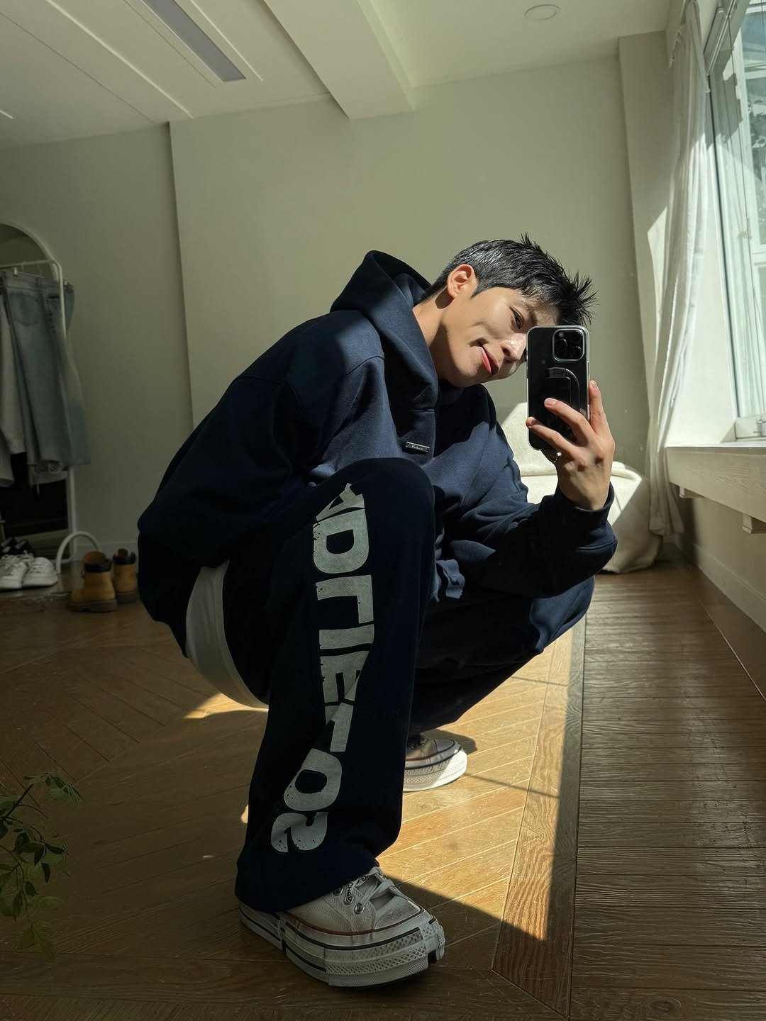 Photo shared by Daeheon Kang on October 11, 2025 tagging @kkst.official. May be an image of phone, sweatpants, sweatshirt, sweatsuit, mirror and text.