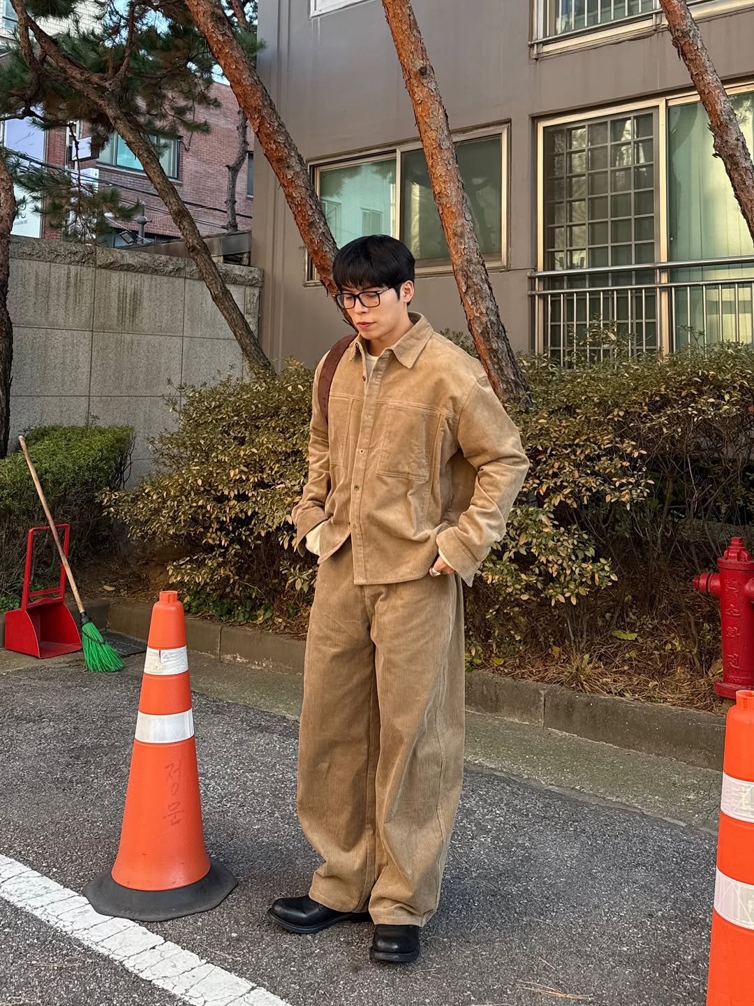 Photo shared by Daeheon Kang on November 20, 2025 tagging @kkst.official. May be an image of duffle coat, overcoat, military uniform, suit and text.