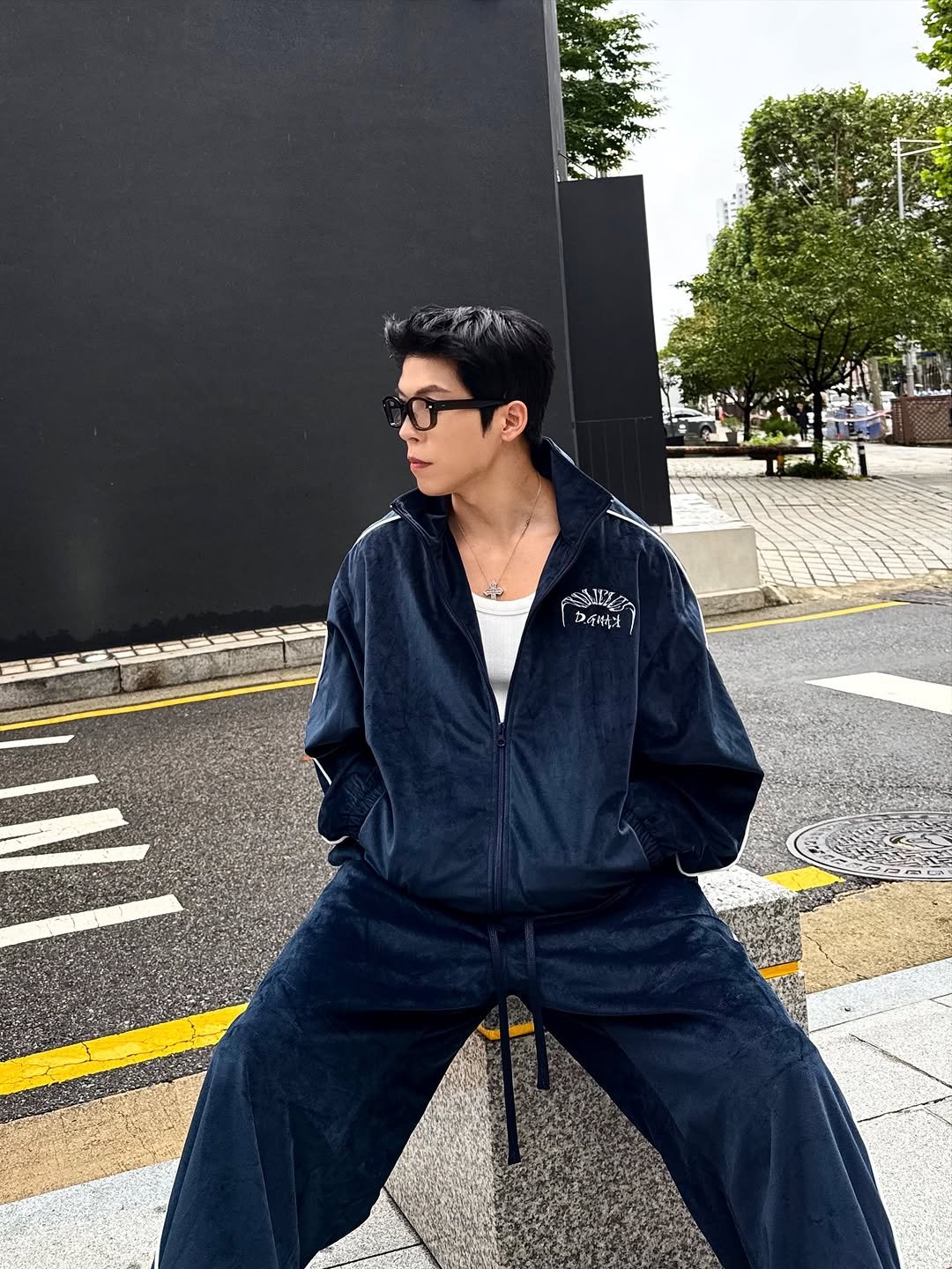 Photo shared by Daeheon Kang on October 15, 2025 tagging @kkst.official. May be an image of duffle coat, sweatpants, parka, jacket, sportswear and text.