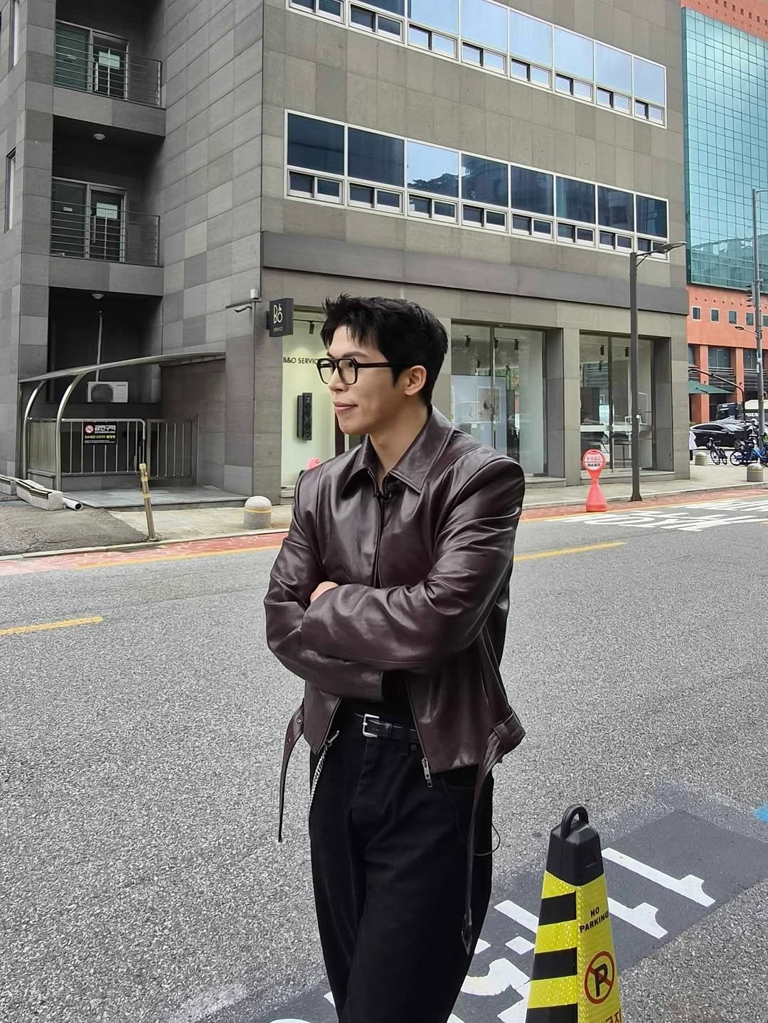 Photo shared by Daeheon Kang on September 27, 2025 tagging @kkst.official. May be an image of 1 person, suit, coat, street and text.