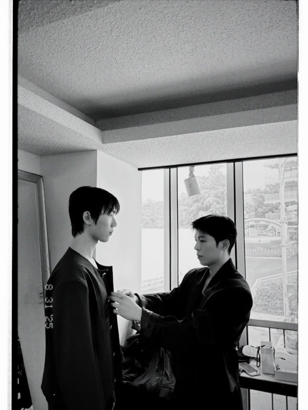 Photo by Daeheon Kang on September 11, 2025. May be a black-and-white image of 2 people, suit, dinner jacket, bath robe and text.