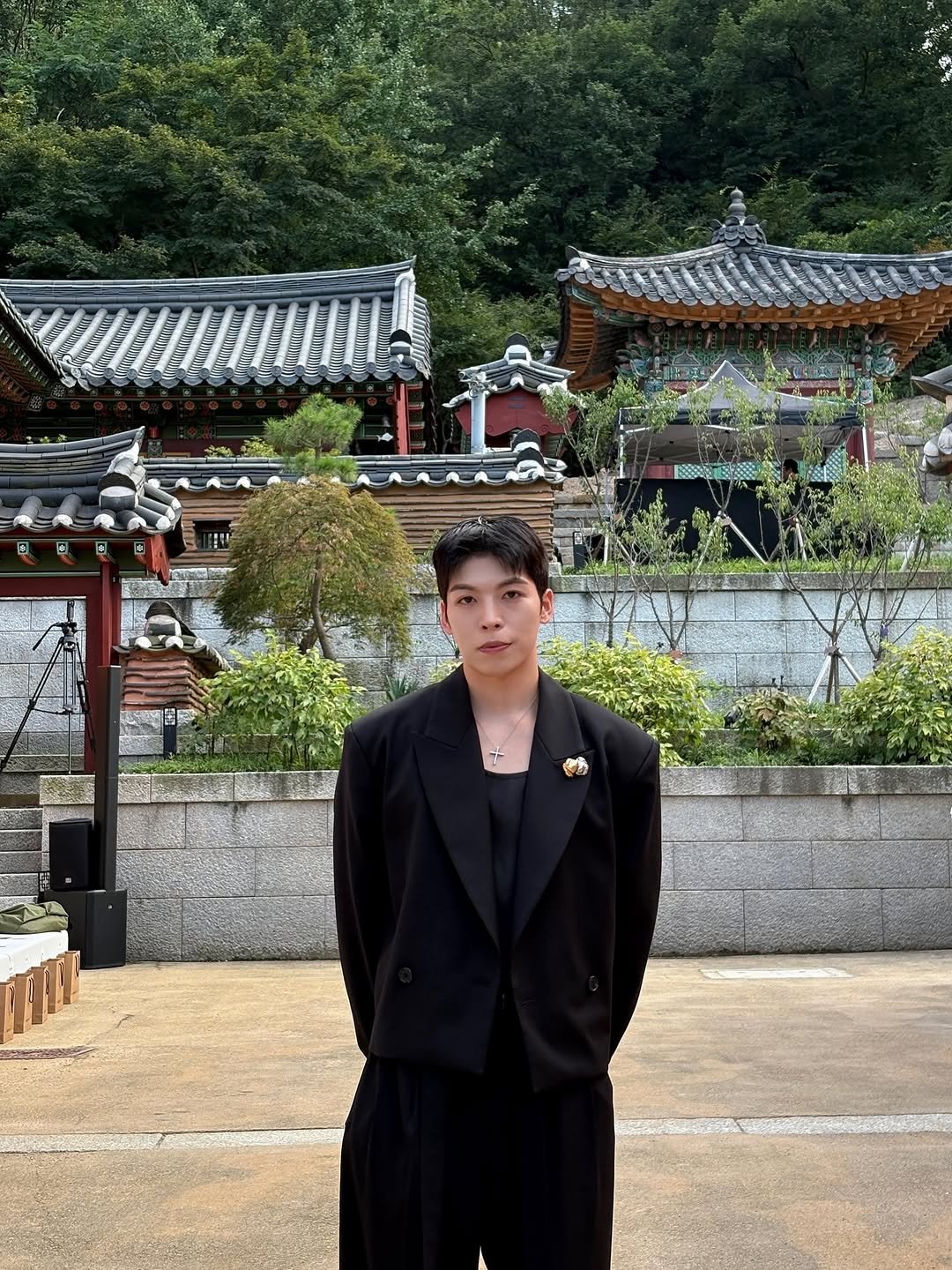Photo by Daeheon Kang on September 17, 2025. May be an image of 1 person, overcoat, bolo tie, suit, blazer, Fushimi Inari Taisha, Gyeongbokgung Palace and text.