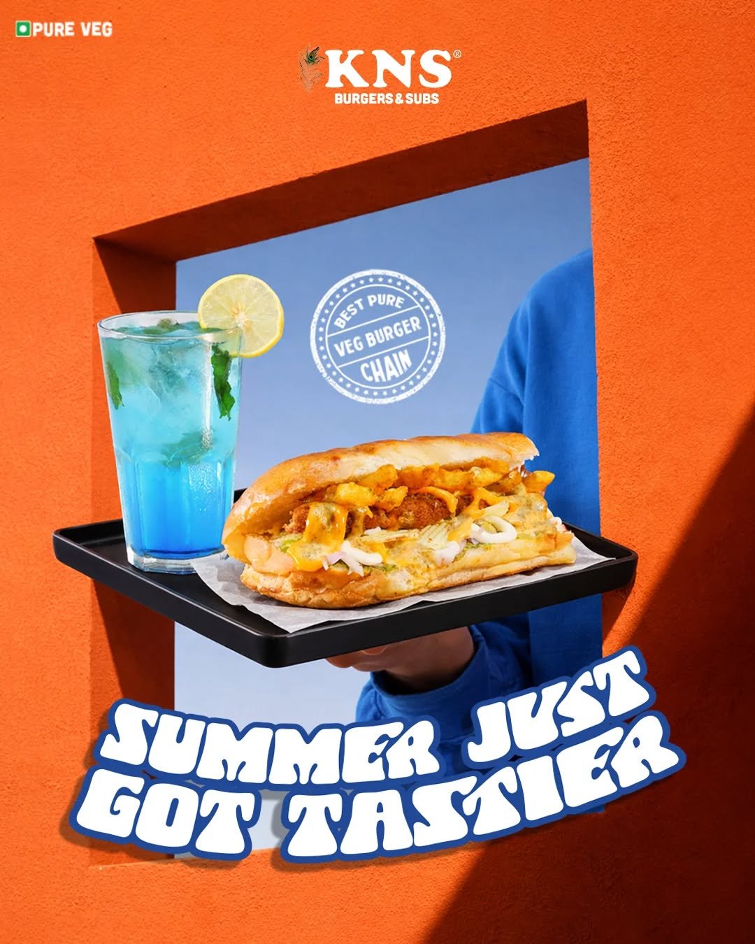 Photo by KNS Official on April 17, 2026. May be an image of chicken sandwich, drink, poster and text that says 'OPURE VEG KNS BURGERS&SI BURGERS&SUBS SUBS BESTPURE PURE VEG BEST GBURGER BURGER CHAIN SUMMER TASSI MASSTER JUST GOT'.