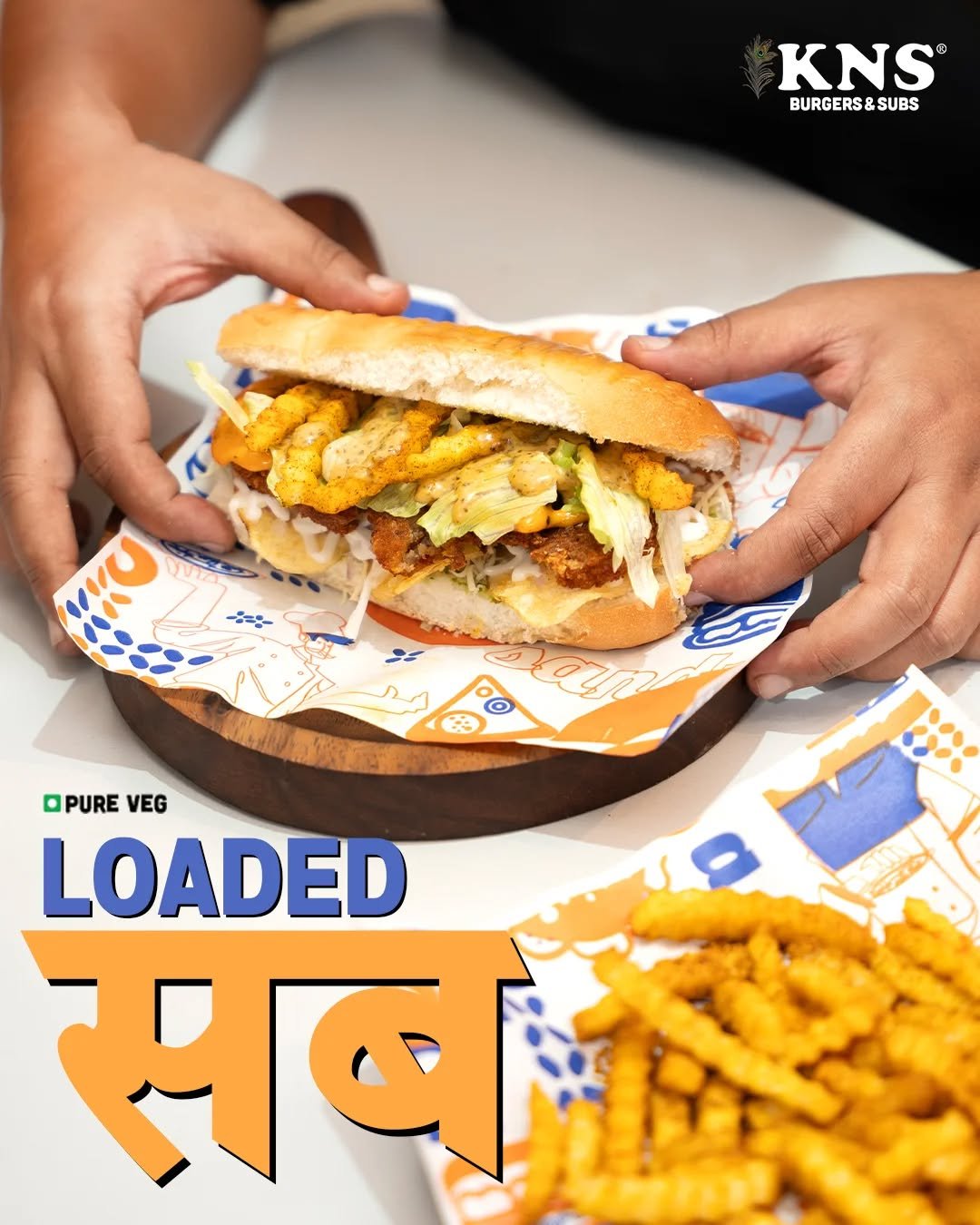 Photo by KNS Official on September 17, 2025. May be an image of 1 person, chicken sandwich, gyro, burger, french fries, buns and text that says 'KNS ® ម BURGERS&S BURGERS&SUBS SUBS WU OPURE VEG LOADED सबम ትግደራ'.