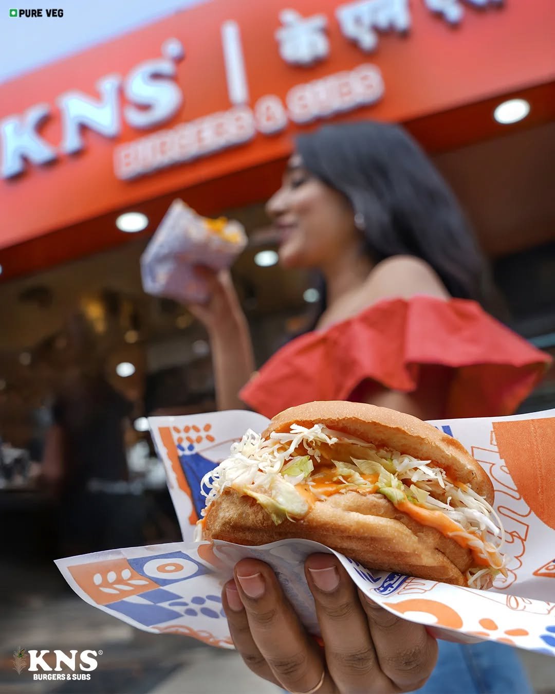 Photo by KNS Official on September 24, 2025. May be an image of ‎2 people, hotdog, chicken sandwich, gyro, burger, buns and ‎text that says '‎OPURE VEG KNS BROTOBA NS! G ENEB SONESO パパパ〇 حه O KNS BURGERS&SUBS SUBS BURGERS‎'‎‎.