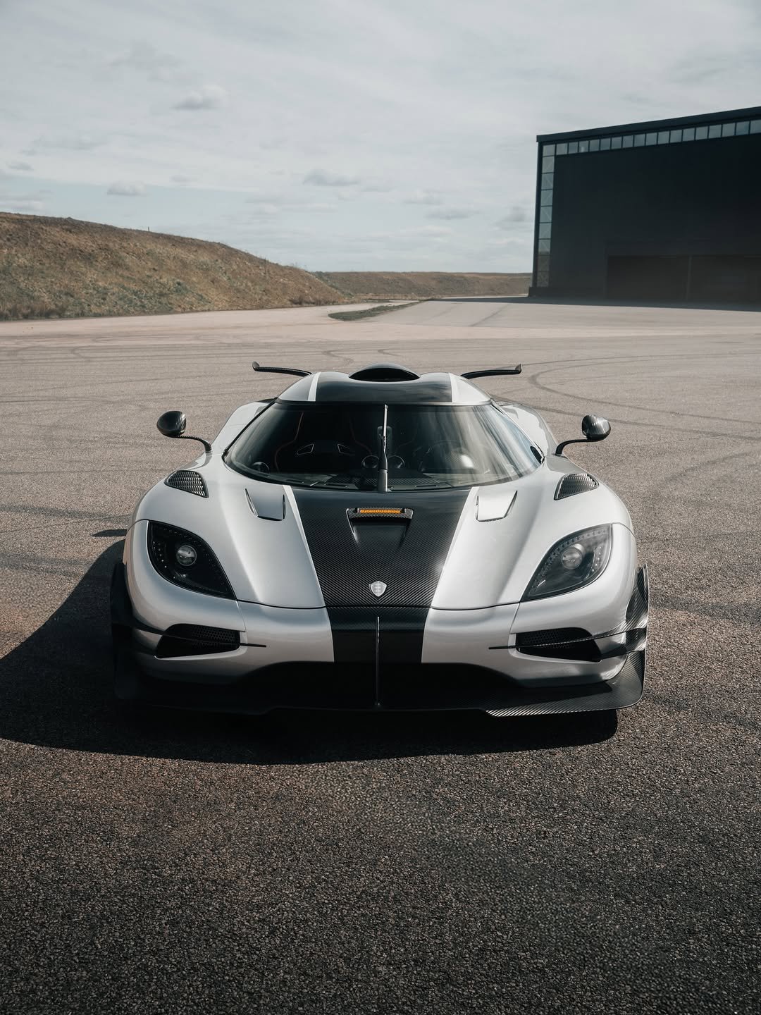 Photo shared by KOENIGSEGG on April 17, 2026 tagging @carinalima_racing. May be an image of racing vehicles, race car, wheel, road and text.