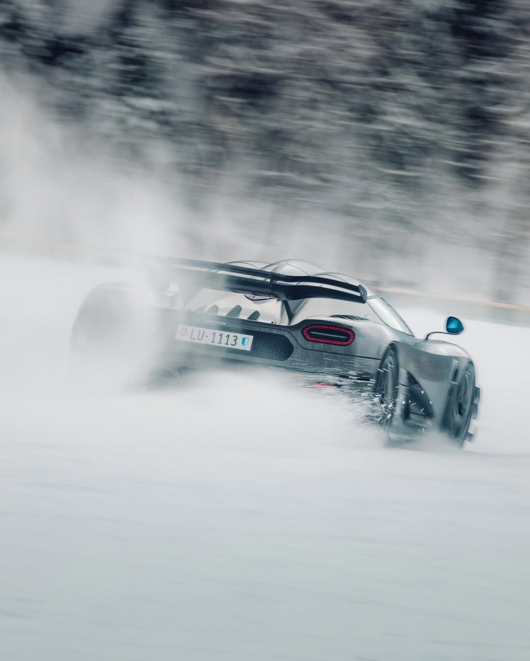 Photo shared by KOENIGSEGG on January 30, 2026 tagging @carageluzern. May be an image of racing vehicles, race car, blower, road, snow and text.