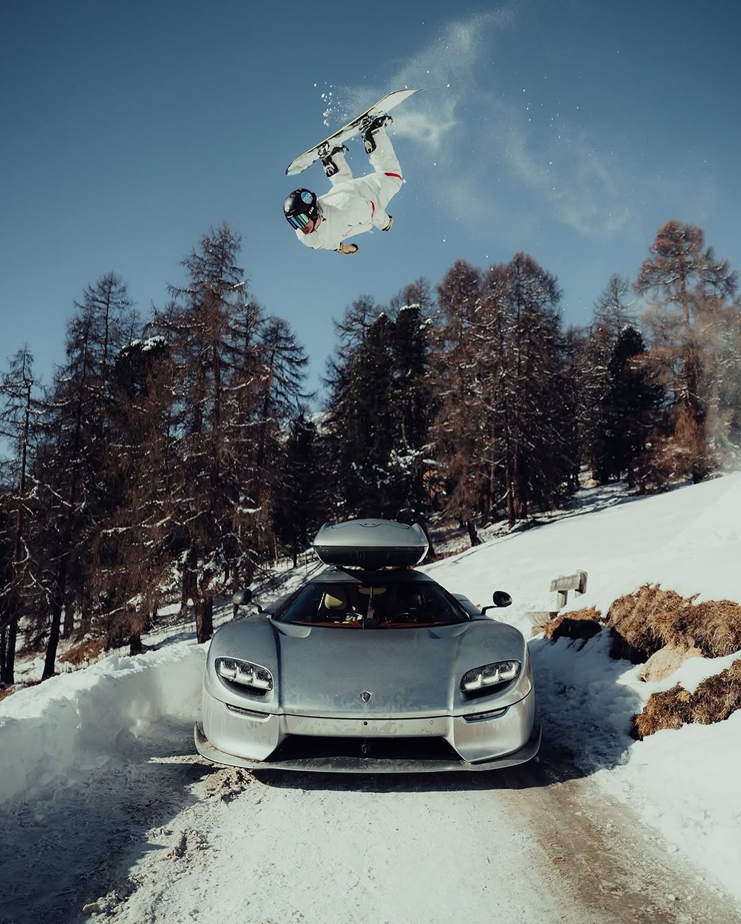 Photo shared by KOENIGSEGG on February 02, 2026 tagging @hubercop, and @carageluzern. May be an image of car, ski, wheel, ski slope, snow and text.