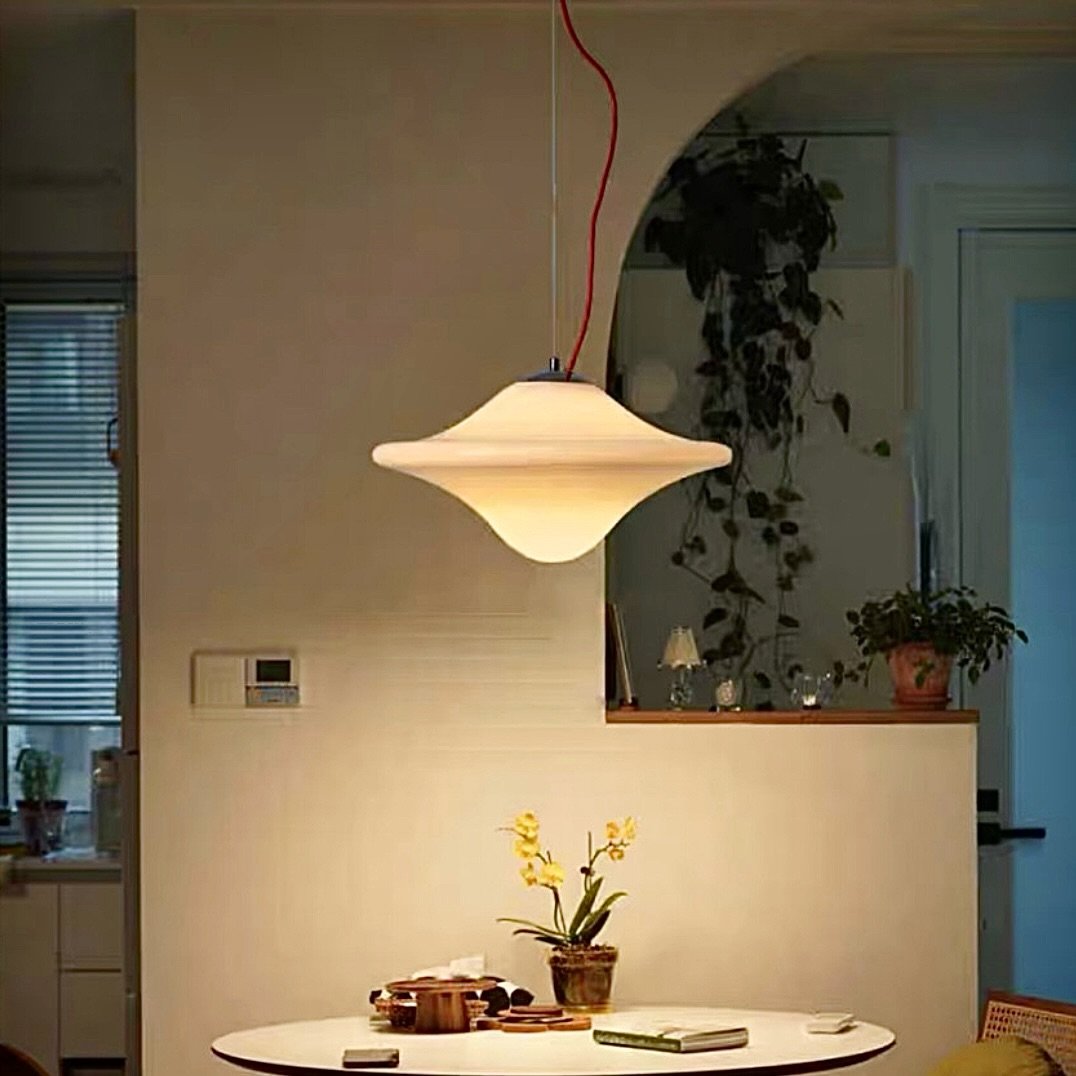 Photo by 코제 아뜰리에 on June 27, 2025. May be an image of lighting, dining table, lamp shade and indoors.