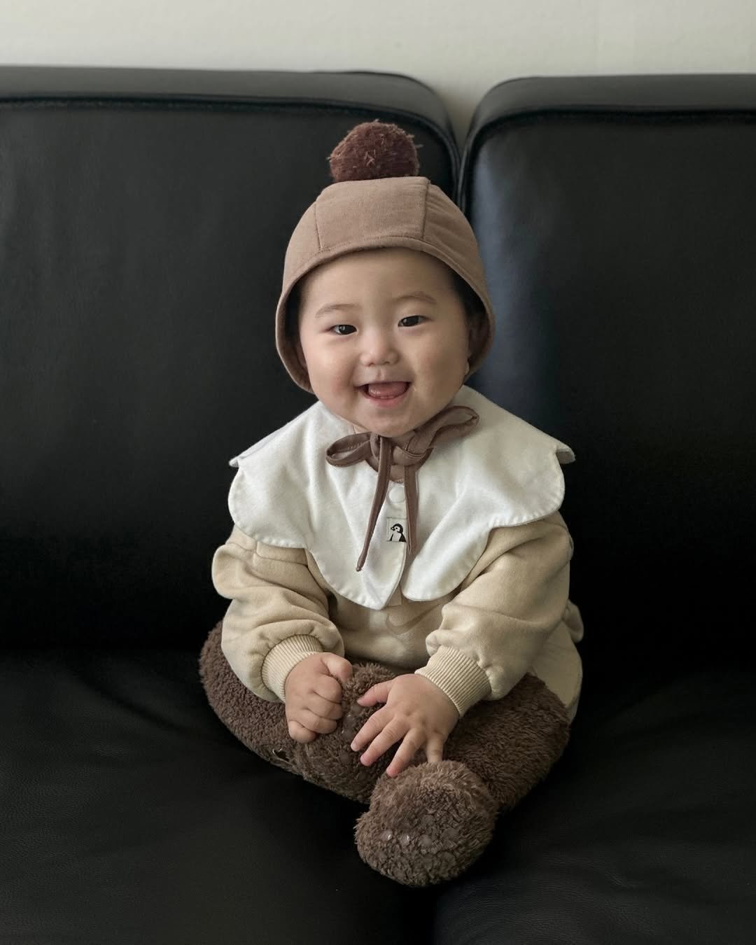 Photo shared by Konny l 코니 on October 30, 2025 tagging @shin.maelim. May be an image of baby, duffle coat and hat.