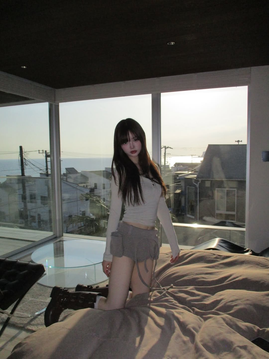 Photo shared by このん on March 22, 2026 tagging @chateau_marine_. May be an image of miniskirt, bedroom and text.