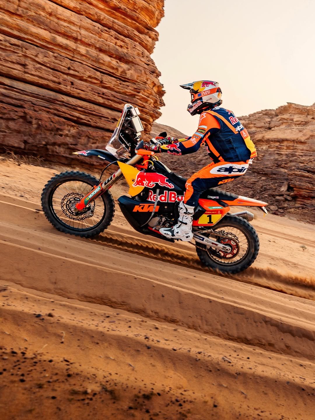 Photo shared by KTM Factory Racing on January 06, 2026 tagging @dakarrally, @danielsanders_11, @ktm_official, @redbullmotorsports, @motorex_powersports, @wp_suspension, and @officialw2rc. May be an image of racing vehicles, dirt bike, motorcycle, helmet and text.