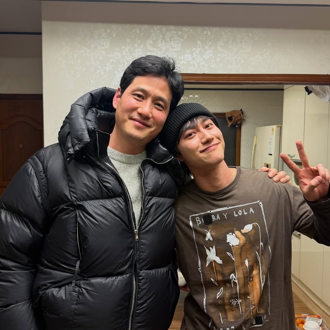 Photo by 곽동연 on February 20, 2026. May be an image of one or more people, goosedown coat, top, parka and text that says 'BAY BAYLOLA Y LOL LOLA BA'.