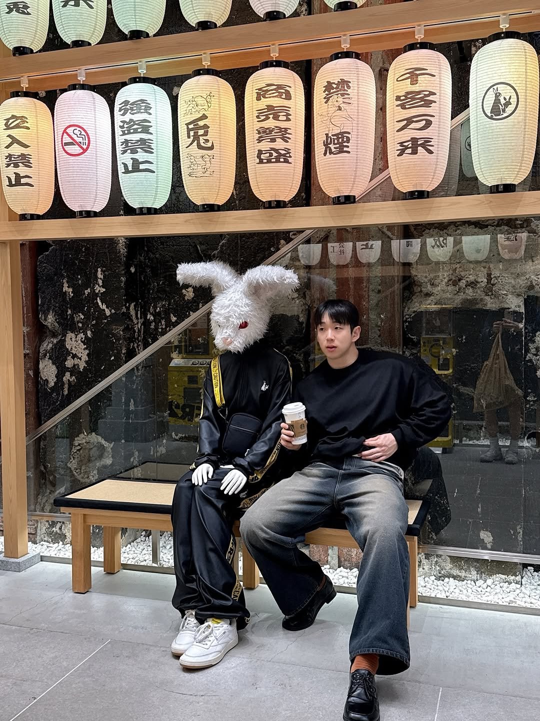 Photo by 권범준 on March 30, 2026. May be an image of one or more people, duffle coat and text.