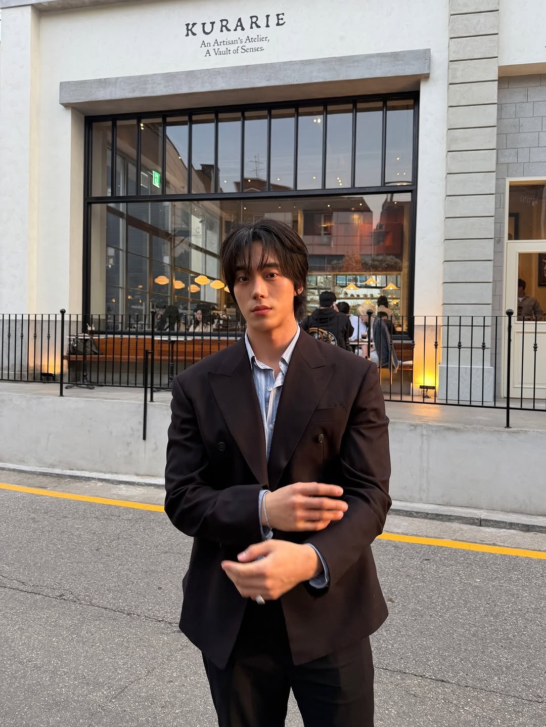 Photo by KWON STAR on April 27, 2026. May be an image of one or more people, overcoat, wrist watch, dinner jacket, suit, blazer and text.