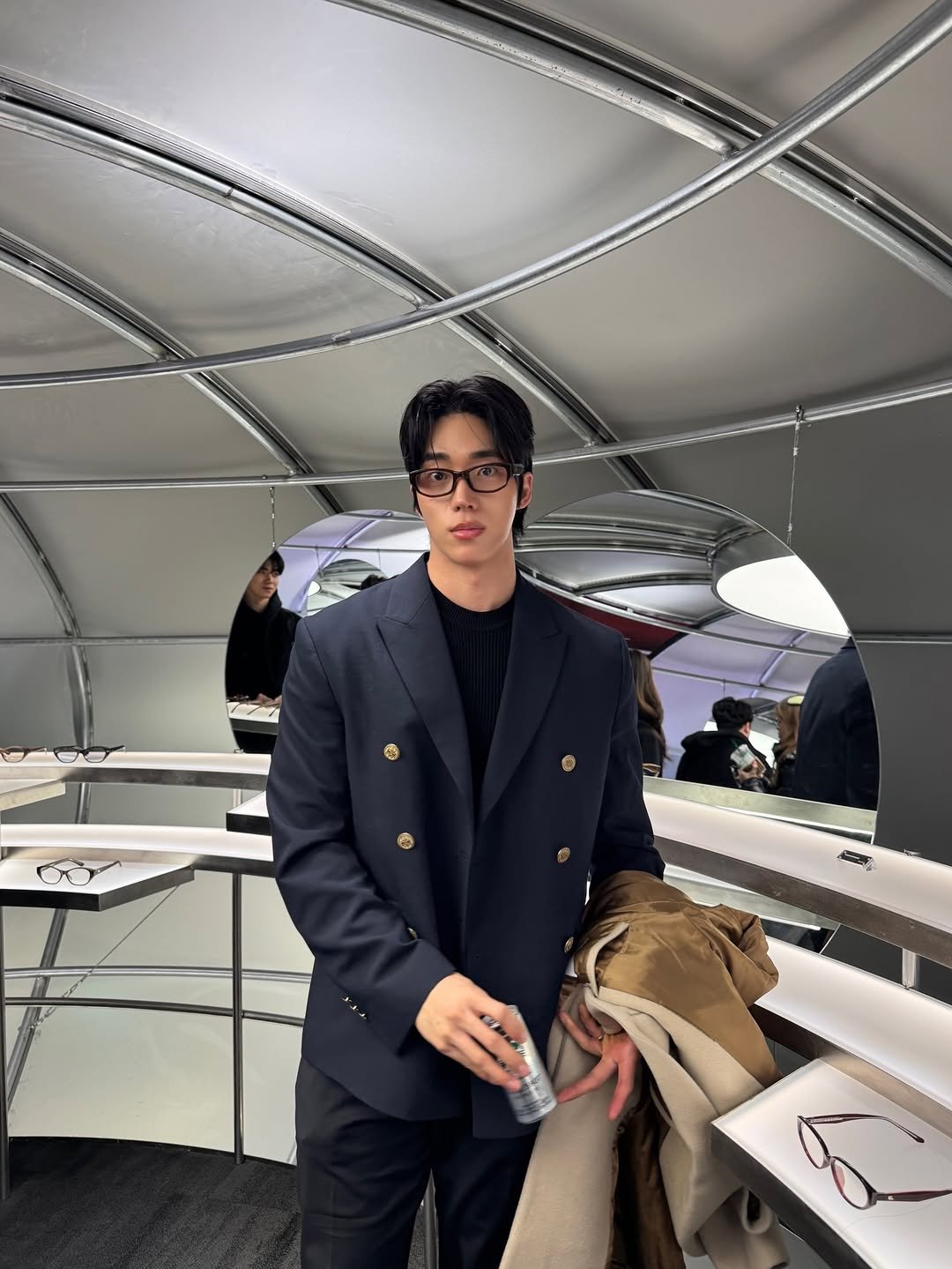 Photo shared by KWON STAR on February 11, 2026 tagging @blueelephant.co. May be an image of duffle coat, overcoat, wingtip shoes, suit and text.