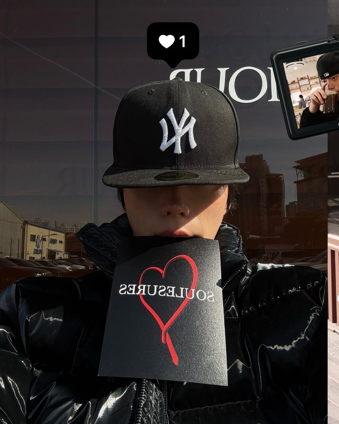 Photo by KWON STAR on February 06, 2026. May be an image of one or more people, phone, hat, parka, face mask and text.