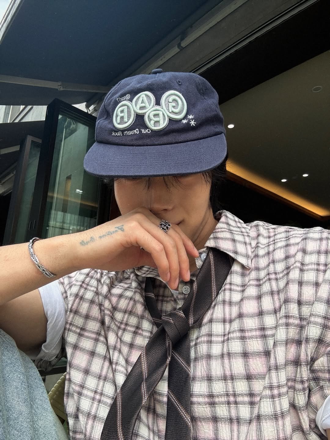 Photo shared by KWON STAR on April 24, 2026 tagging @knockit_official. May be an image of hat, bolo tie, bandanna, beret and text.