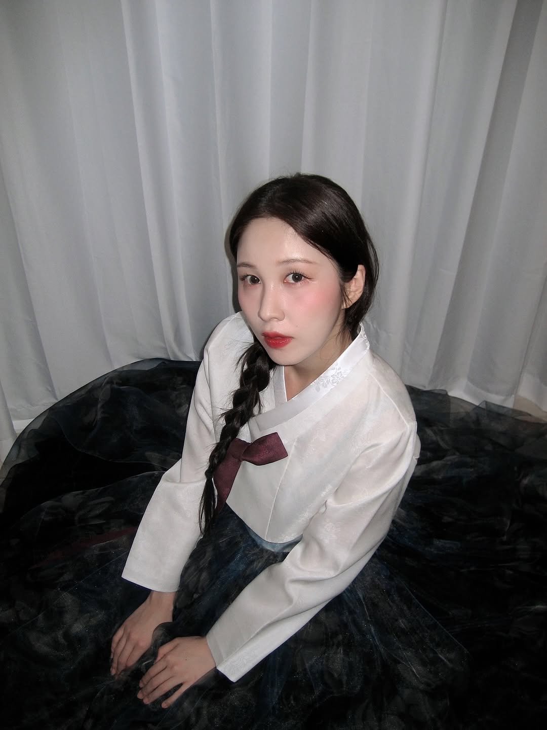 Photo by 권진아 KWON JINAH on October 03, 2025. May be an image of 1 person, braids, makeup, dress and text.