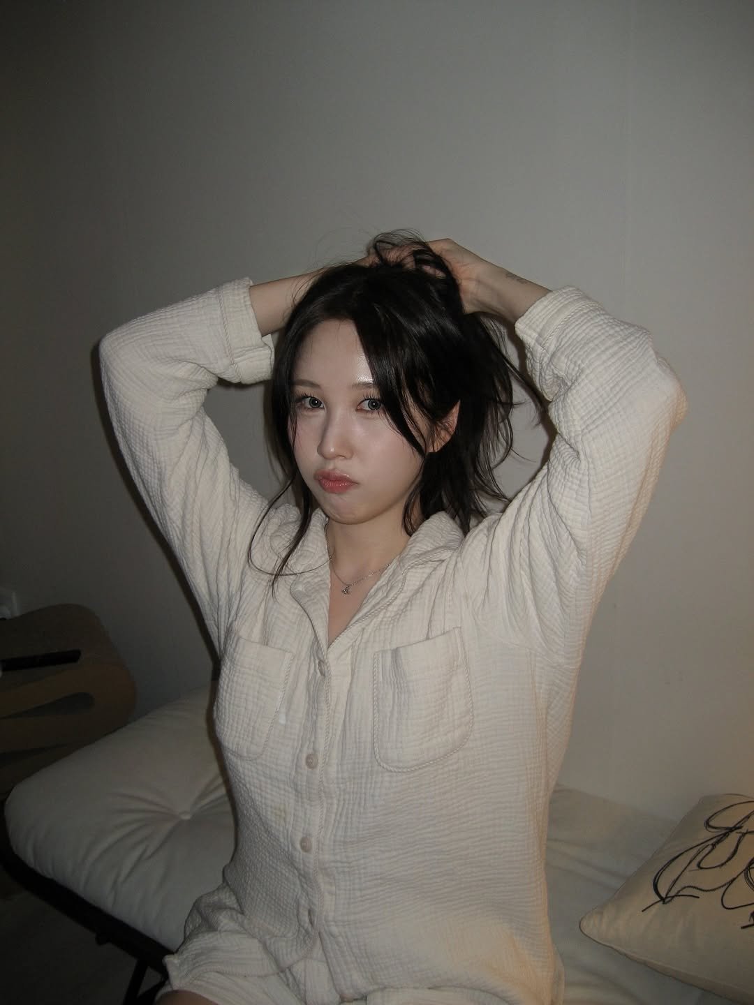 Photo by 권진아 KWON JINAH on February 26, 2026. May be an image of one or more people, hair, sleepwear, bath robe and text.