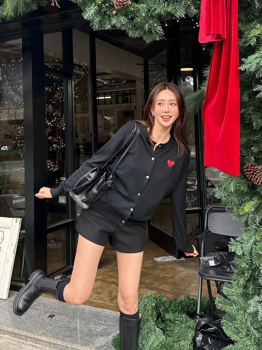 Photo by 권슈나 on November 08, 2025. May be an image of parka, miniskirt, boots and text.