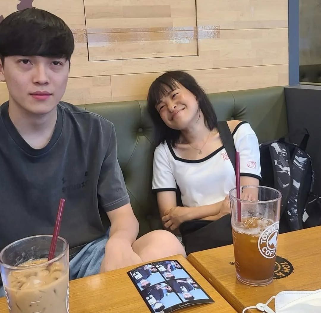 Photo by 김윤태 on November 14, 2025. May be an image of one or more people, drink and text.