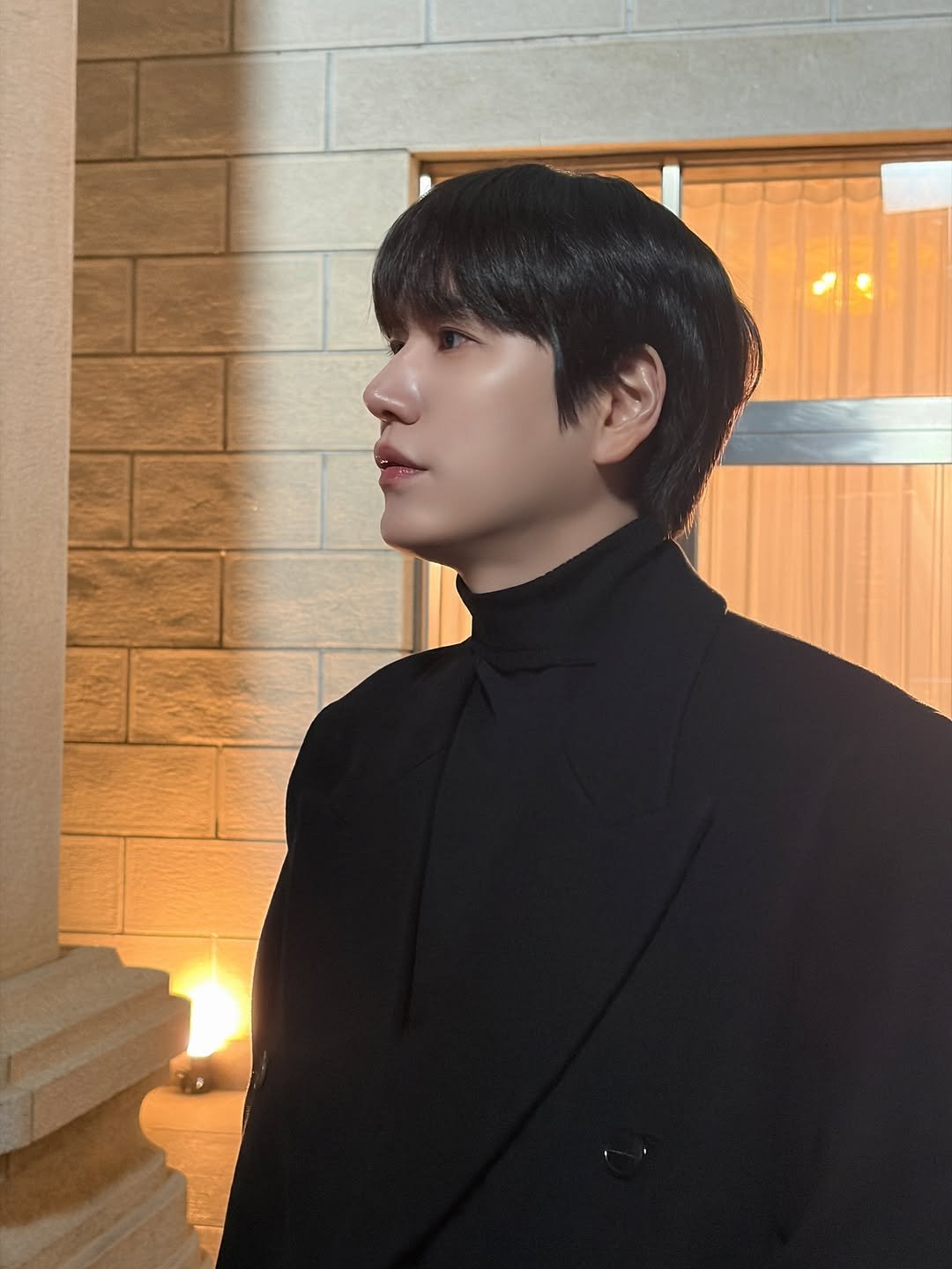 Photo shared by 규현 KYUHYUN on November 27, 2025 tagging @gyuram88. May be an image of bolo tie and text.