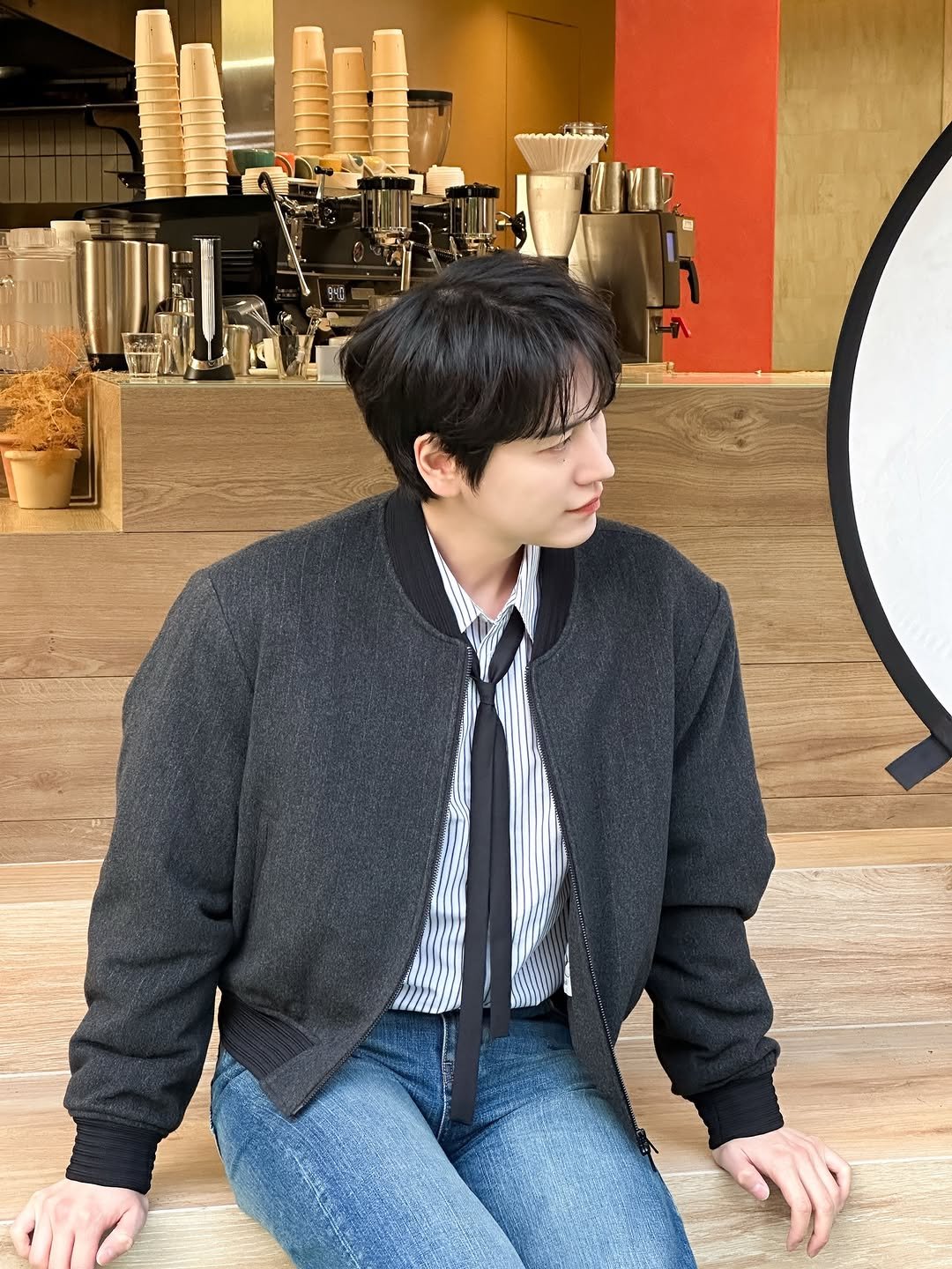 Photo shared by 규현 KYUHYUN on February 21, 2026 tagging @gyuram88. May be an image of duffle coat, bolo tie and text.