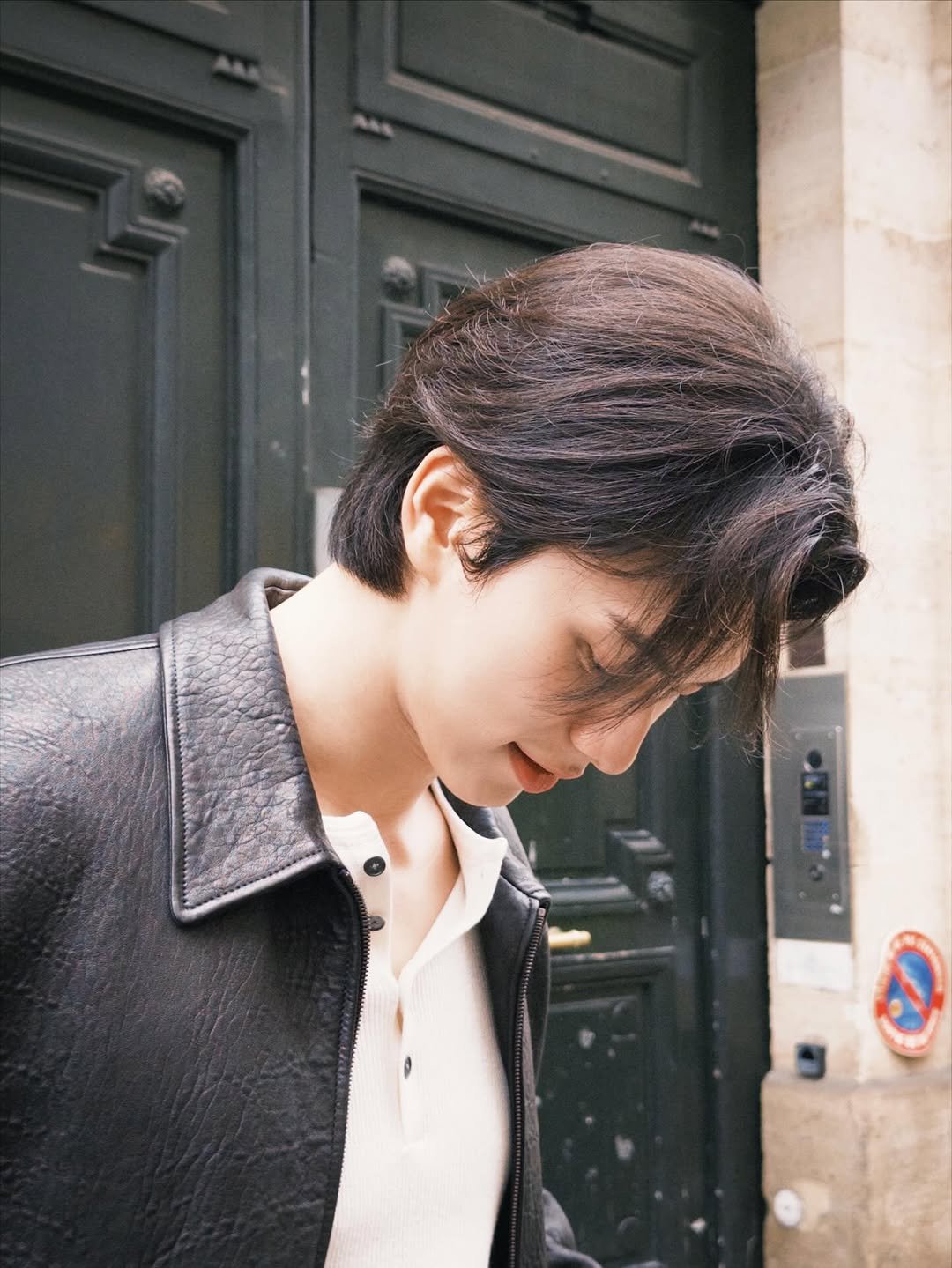 Photo shared by 이채민 Lee Chae Min 李彩玟 on January 28, 2026 tagging @ysl, and @anthonyvaccarello. May be an image of one or more people, hair, duffle coat, bolo tie and text.