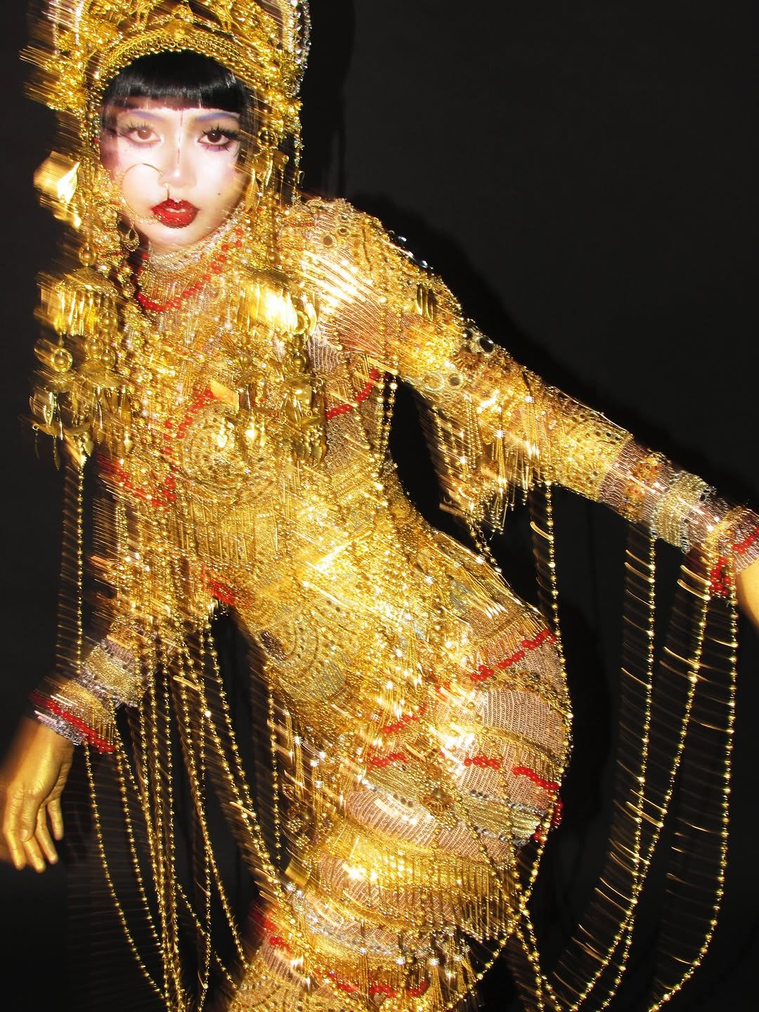 Photo by LISA on October 31, 2025. May be an image of one or more people, makeup, headdress, costume and text.