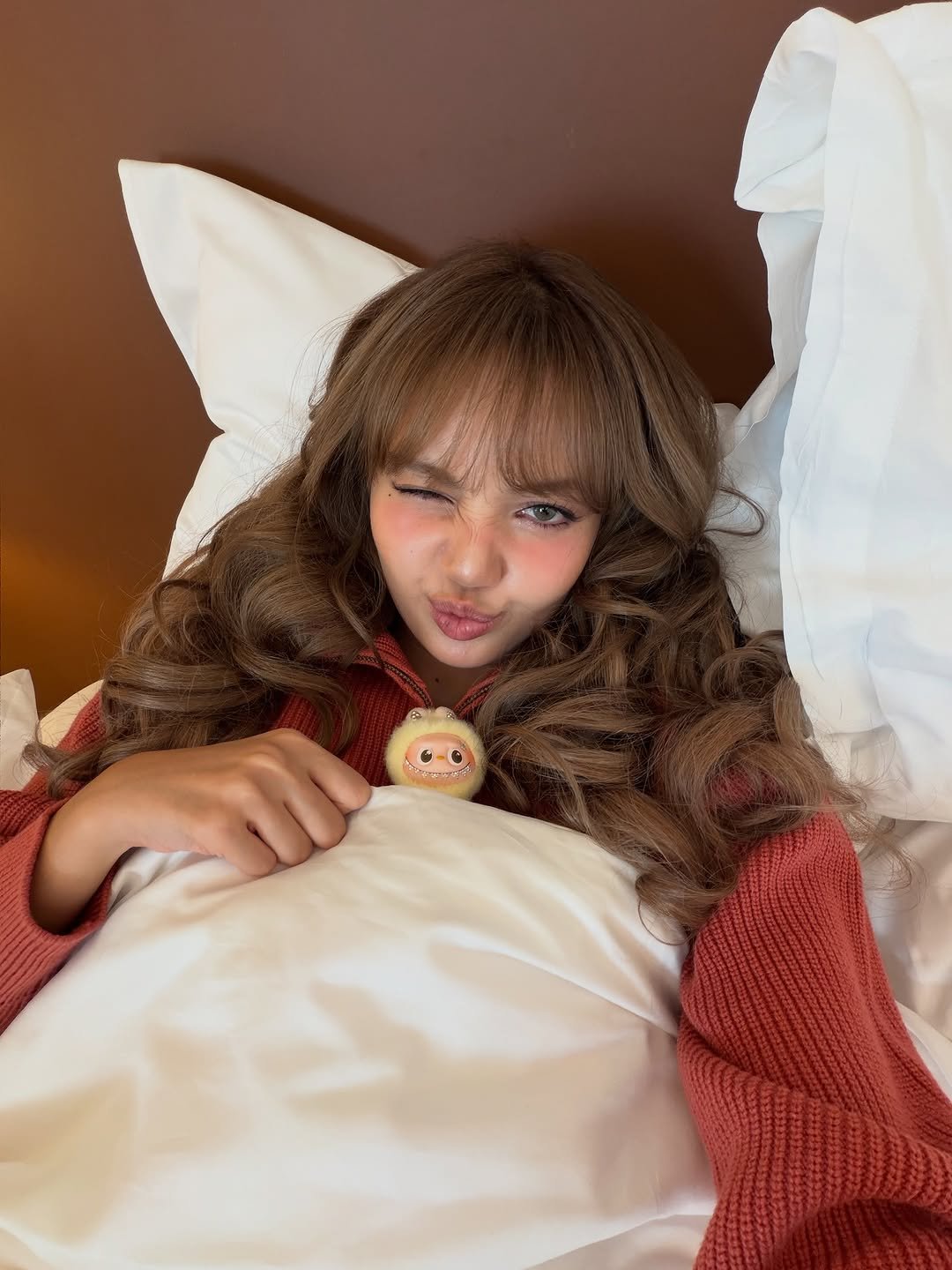 Photo by LISA on October 13, 2025. May be an image of one or more people, hair, makeup, people sleeping, sleepwear, costume, bath robe, robe, bed, bedroom and text.