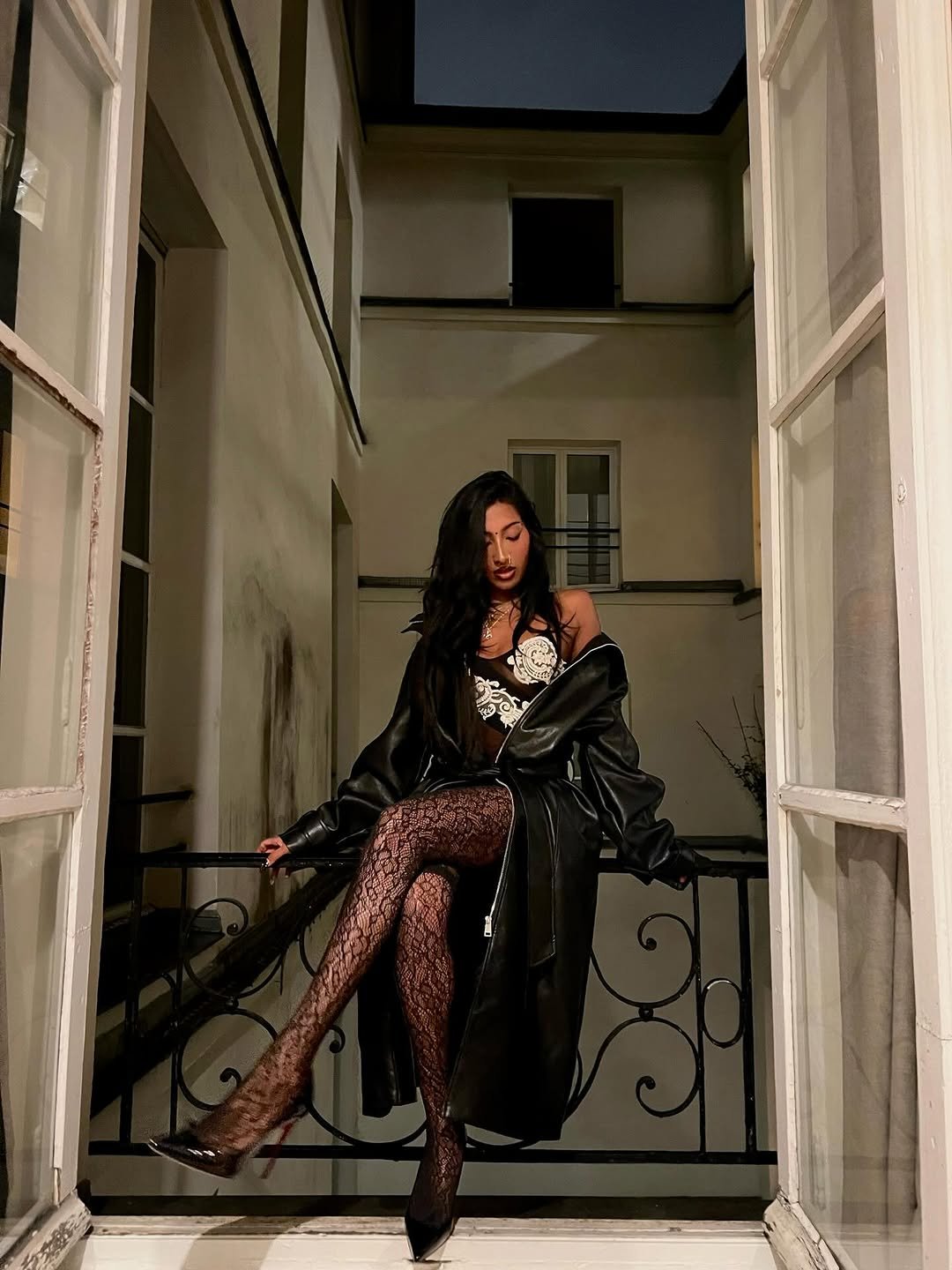 Photo by LARA RAJ on January 09, 2026. May be an image of fire escape, fishnet stockings, Sacré-Cœur and text.