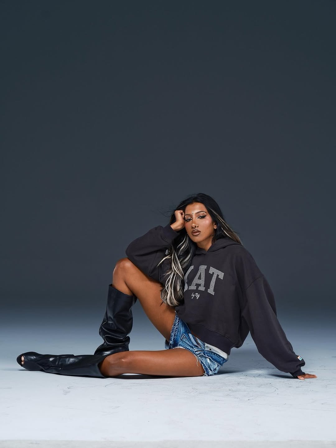 Photo by LARA RAJ on April 27, 2026. May be an image of one or more people, makeup, miniskirt, sweatshirt and text.